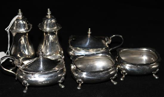 A matched silver six piece condiment set.